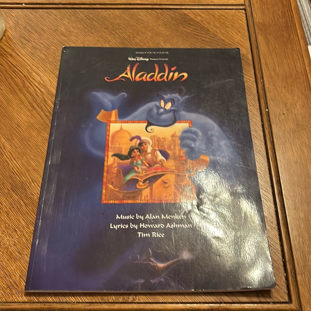 Aladdin music book for piano, vocal and guitar. excellent condition